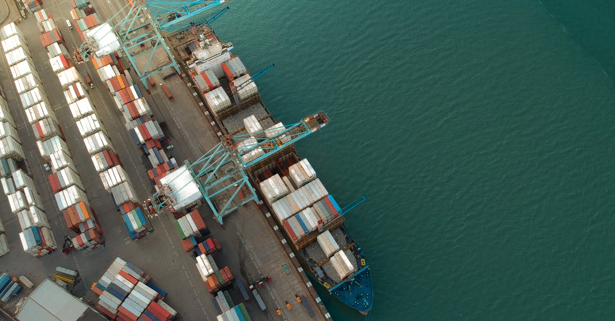 What makes a good vessel for storing sourdough starter? - Top view of harbor with containers and cargo ships located near calm rippling sea water