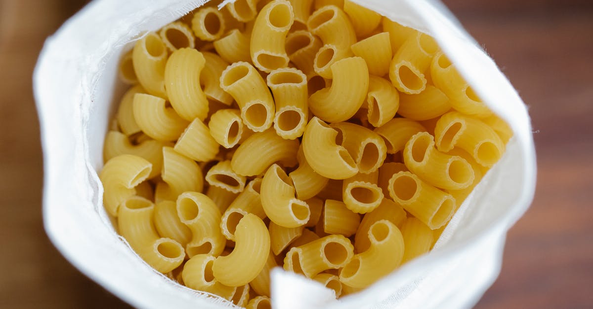 What makes a pasta shape pair with a sauce? - Heap of raw pasta in sack What makes a pasta shape pair with a sauce? - Heap of raw pasta in sack