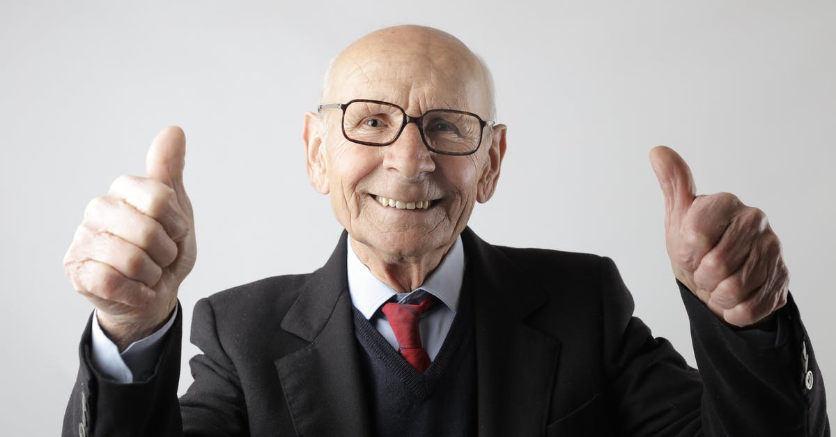 What makes a really good marrow bone? - Positive senior man in eyeglasses showing thumbs up and looking at camera What makes a really good marrow bone? - Positive senior man in eyeglasses showing thumbs up and looking at camera