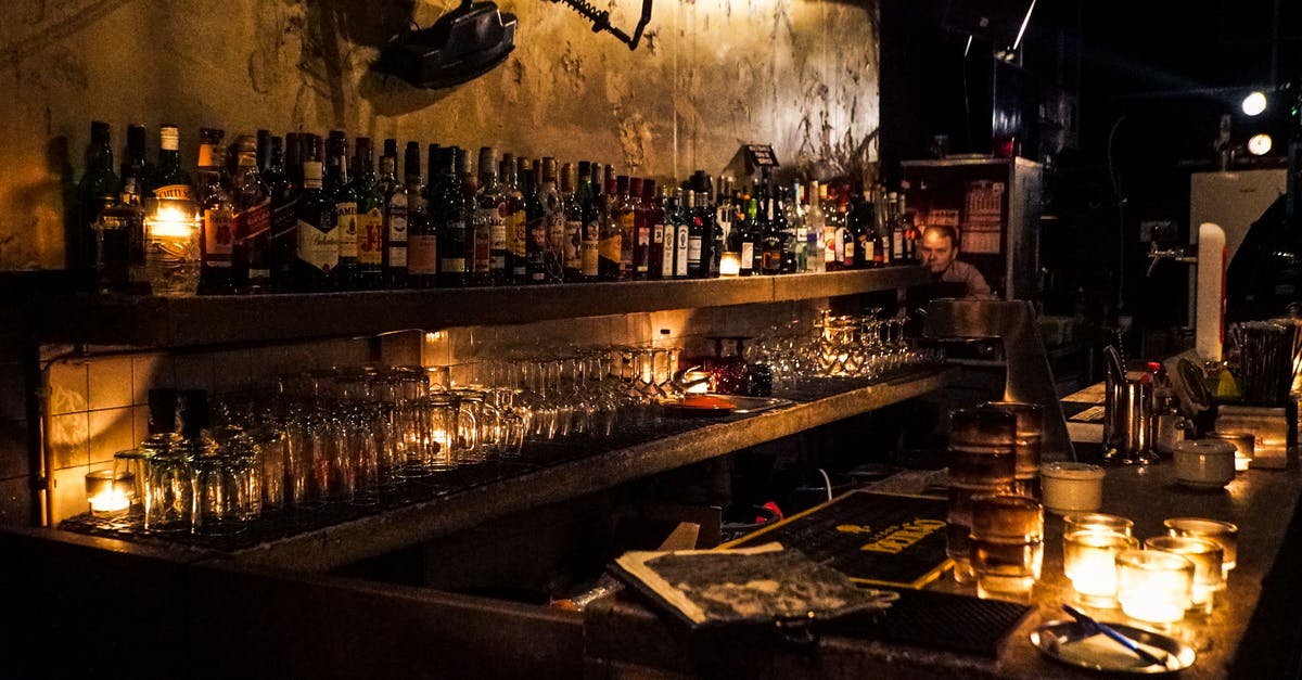 What makes bourbon a decent substitute for vanilla? - Person Sitting Near Bottles What makes bourbon a decent substitute for vanilla? - Person Sitting Near Bottles