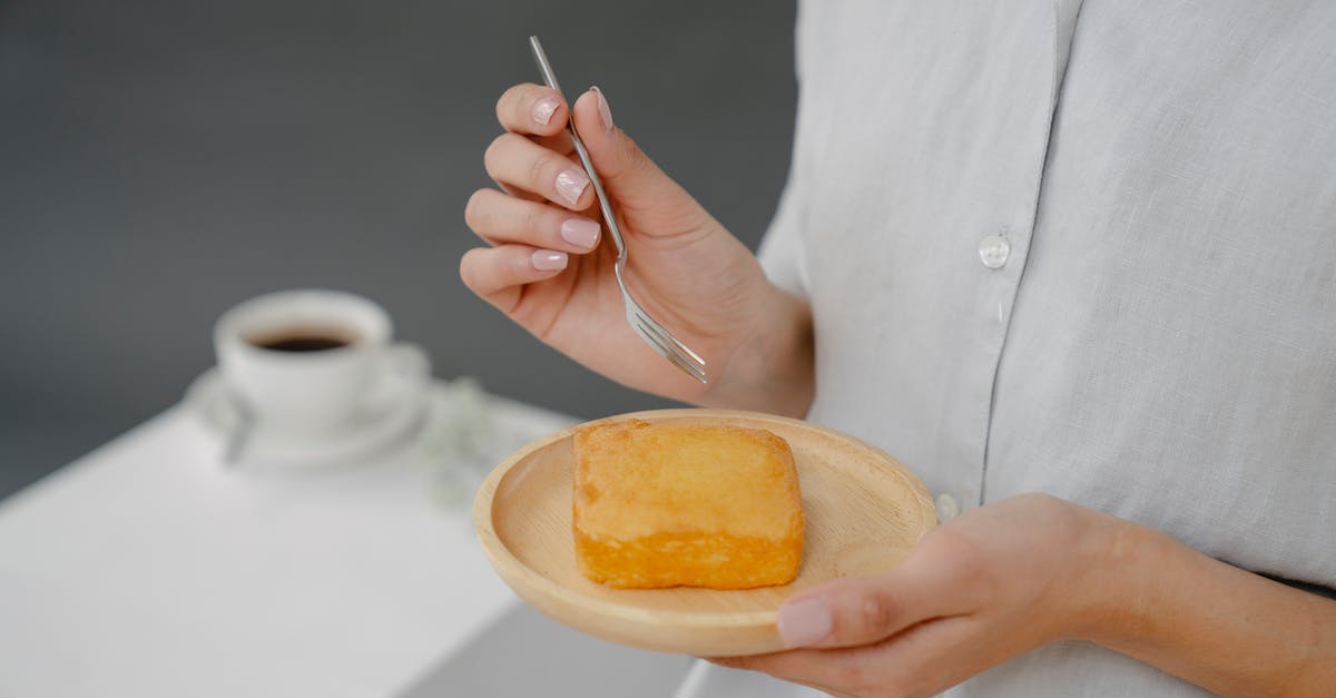 What makes cake a Sponge Cake? And what doesn't? - Soft focus of crop faceless female with tasty fresh butter cake on plate standing on gray background in studio with cup of coffee What makes cake a Sponge Cake? And what doesn't? - Soft focus of crop faceless female with tasty fresh butter cake on plate standing on gray background in studio with cup of coffee