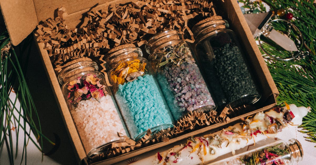 What makes fleur de sel different from regular salt? - Jars of bath salt with dried herbs What makes fleur de sel different from regular salt? - Jars of bath salt with dried herbs