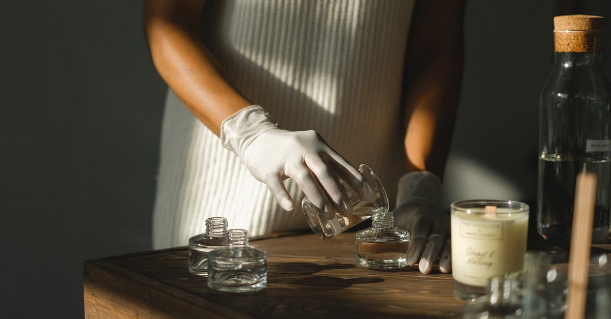 What makes sencha karigane sweeter than sencha? - Unrecognizable crop African American female pouring essential oil in glass bottle while making liquid incense at table What makes sencha karigane sweeter than sencha? - Unrecognizable crop African American female pouring essential oil in glass bottle while making liquid incense at table