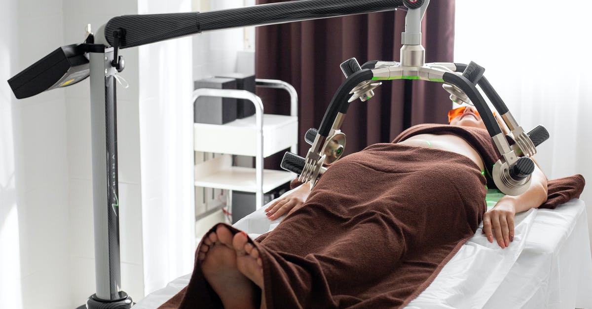 What oil or fat to use for different purposes? - Unrecognizable female under laser weight loss machine on medical table