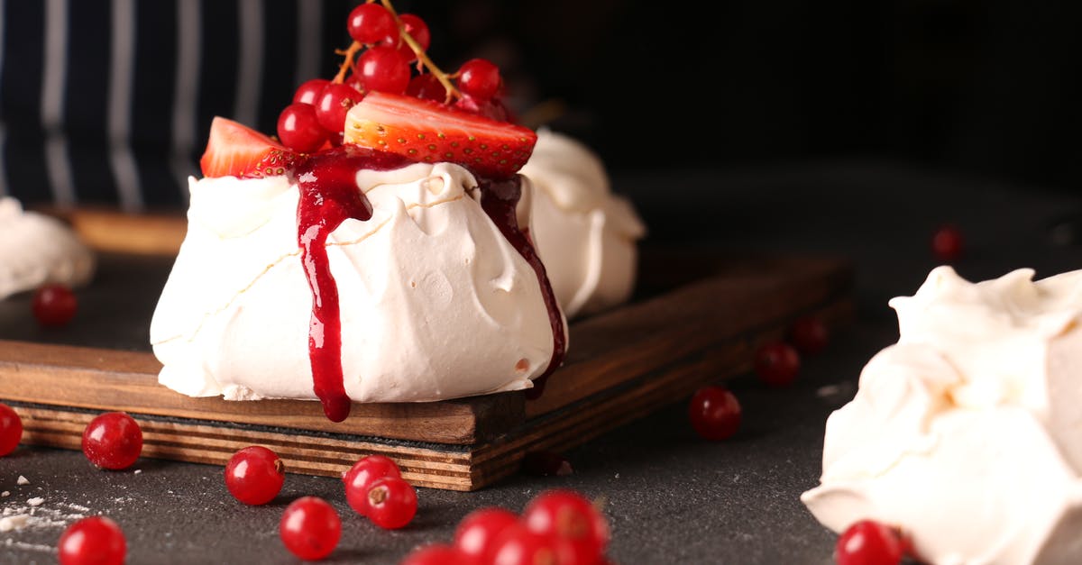 What part or kind of geoduck gives crunchy slender slices? - Unrecognizable cook decorating bright tasty meringue cake with fresh berries What part or kind of geoduck gives crunchy slender slices? - Unrecognizable cook decorating bright tasty meringue cake with fresh berries