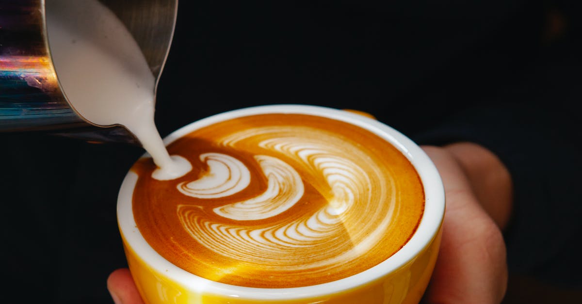 What plant-based (non-dairy) milk do not separate when making caffe latte? - Crop barista pouring milk into coffee with foam in cafe What plant-based (non-dairy) milk do not separate when making caffe latte? - Crop barista pouring milk into coffee with foam in cafe
