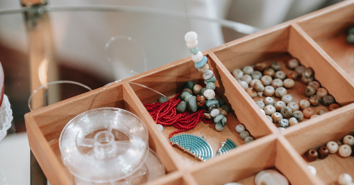 What setting on a thermomix would create a simmer? - Wooden container with abundance of colorful beads and elastic cord for making bracelet placed on glass table in light room What setting on a thermomix would create a simmer? - Wooden container with abundance of colorful beads and elastic cord for making bracelet placed on glass table in light room