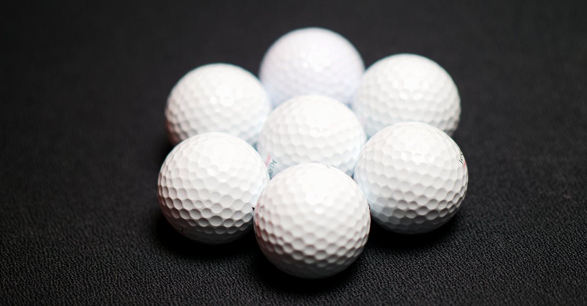 What size disher makes "1 inch balls of dough?" - Set of golf balls on black background What size disher makes "1 inch balls of dough?" - Set of golf balls on black background