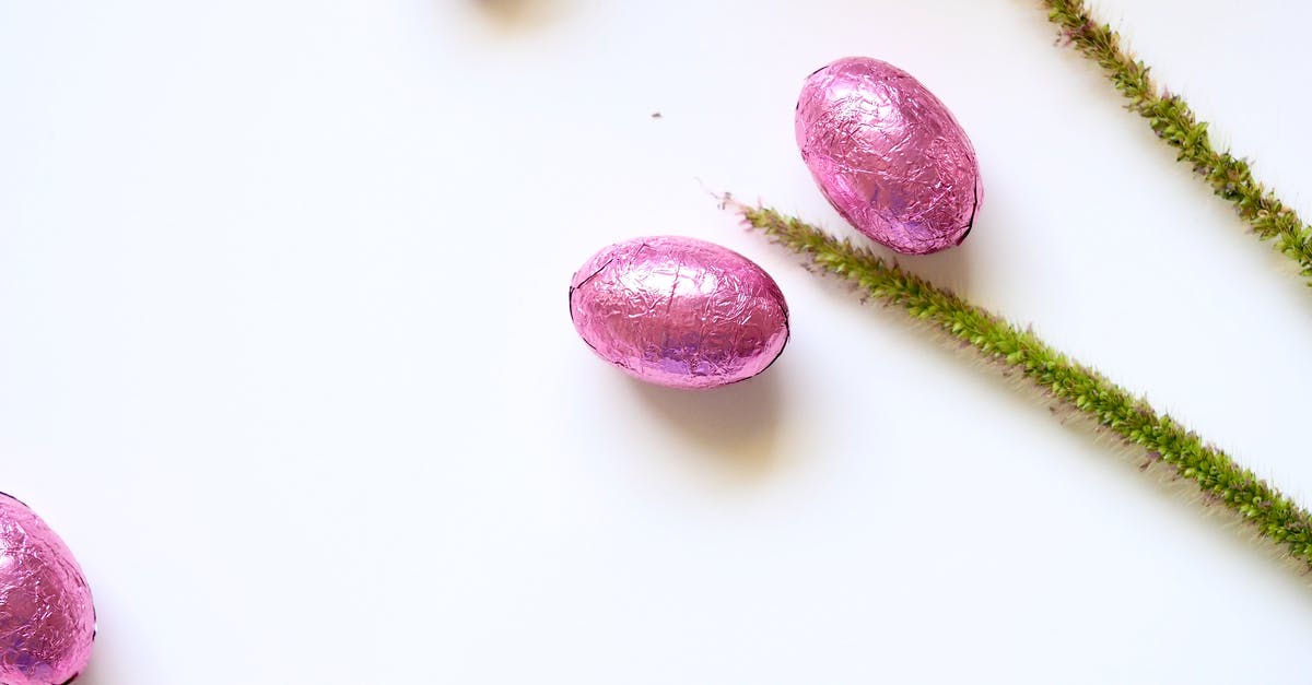 what size foil squares to wrap chocolate truffles? - Delicious sweets near green delicate stems on white table