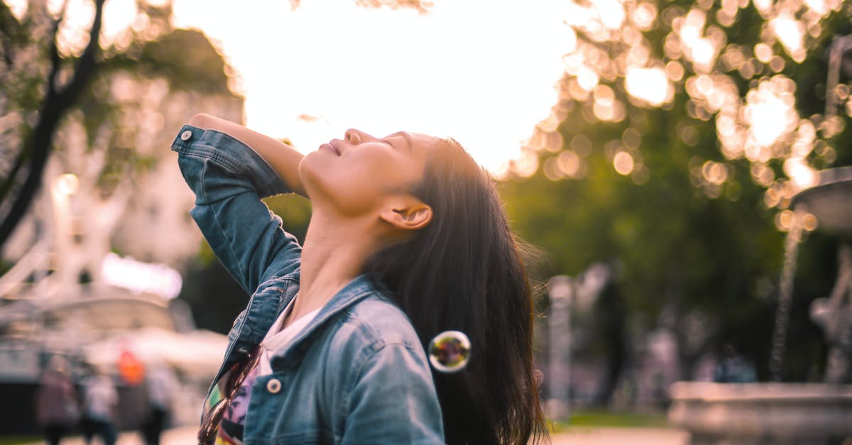What style of icing is this please? - Carefree young woman enjoying life in city park What style of icing is this please? - Carefree young woman enjoying life in city park