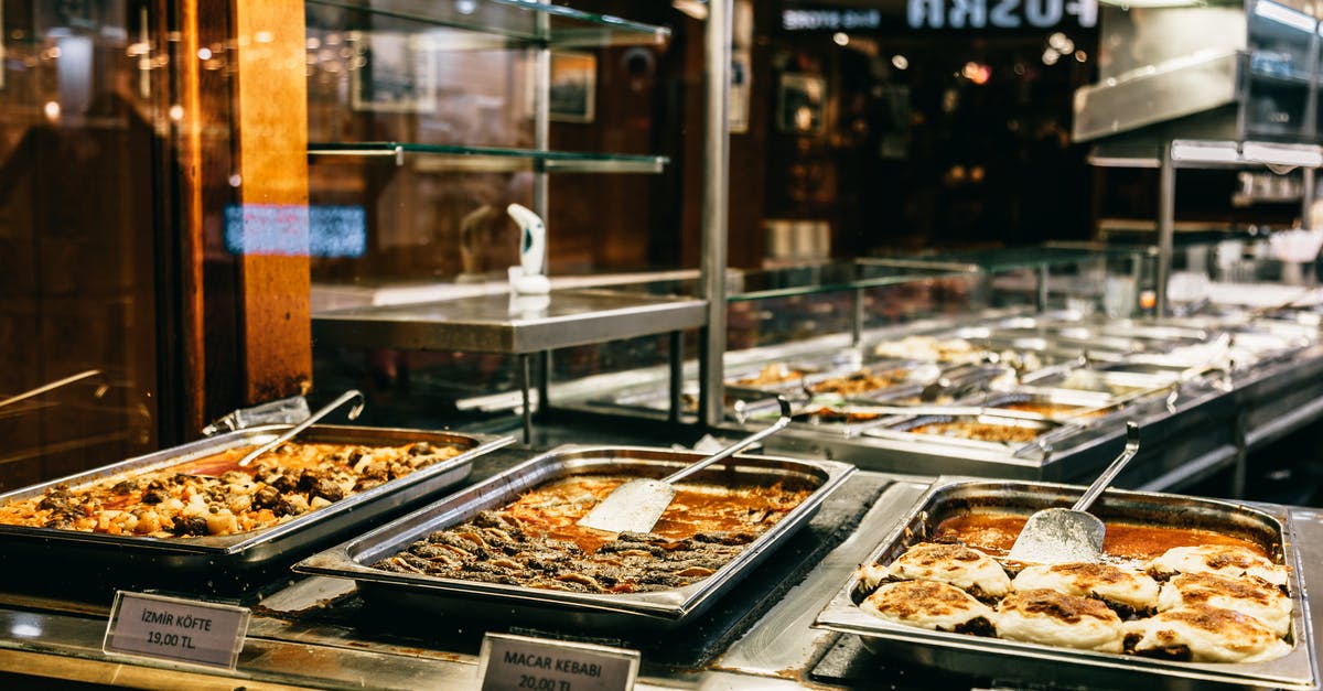 What sushi-like dish consists of various fish in a light sauce? - Different hot dishes in big bowls selling in self service restaurant at night What sushi-like dish consists of various fish in a light sauce? - Different hot dishes in big bowls selling in self service restaurant at night