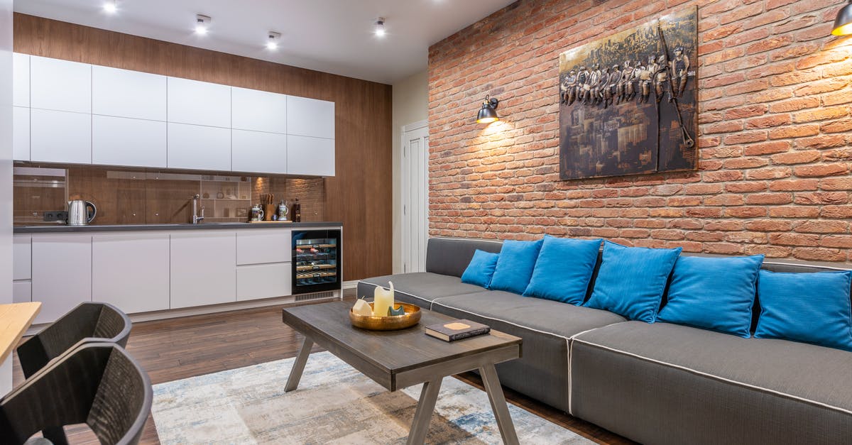 what table material is electric oven safe to place on to? - Modern loft room and kitchen interior with furniture and artwork what table material is electric oven safe to place on to? - Modern loft room and kitchen interior with furniture and artwork