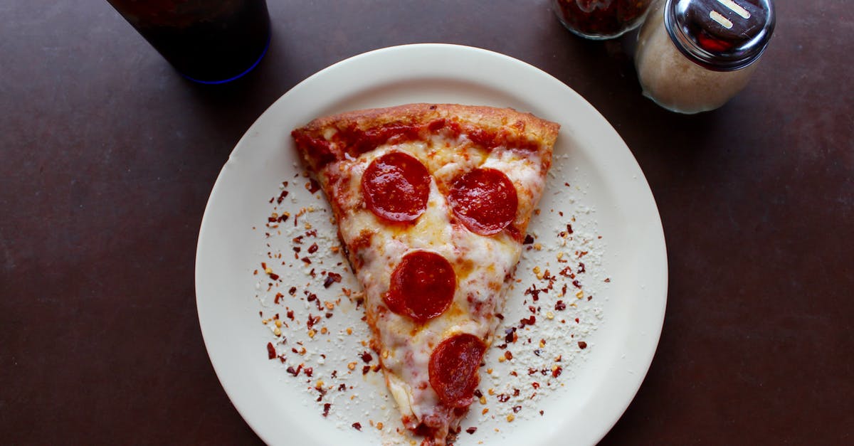 What technique best infuses spices into a dish? - Sliced Pepperoni Pizza on White Ceramic Plate What technique best infuses spices into a dish? - Sliced Pepperoni Pizza on White Ceramic Plate