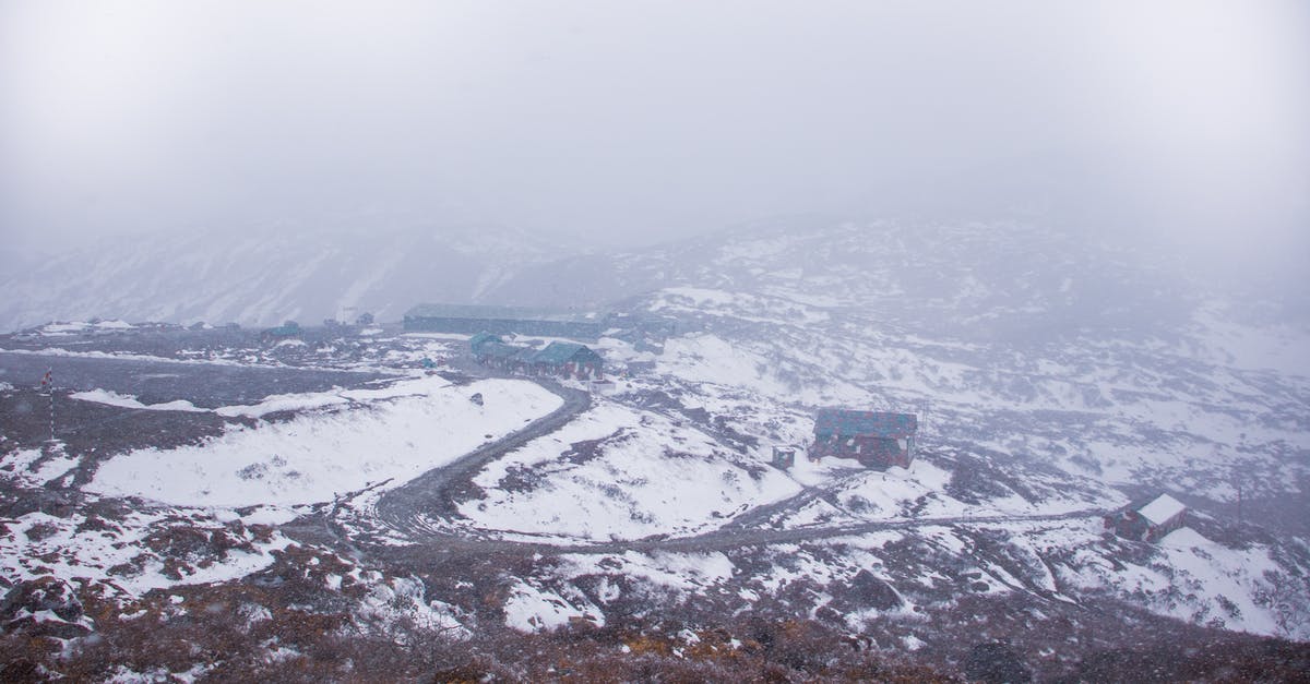 What temperature is 'High' in a 950 watt microwave? - From above of settlement with rustic houses located on snowy area in suburb area in foggy weather on winter day What temperature is 'High' in a 950 watt microwave? - From above of settlement with rustic houses located on snowy area in suburb area in foggy weather on winter day