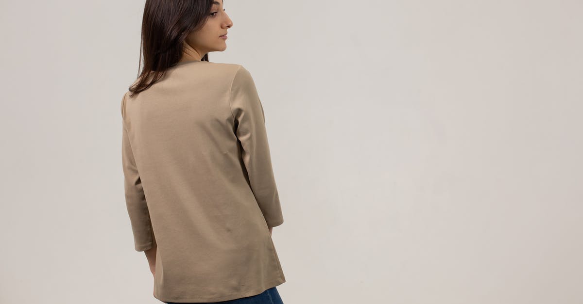 What the gluten look like when kneading for long time on a texture basis - Woman wearing jumper and jeans in studio