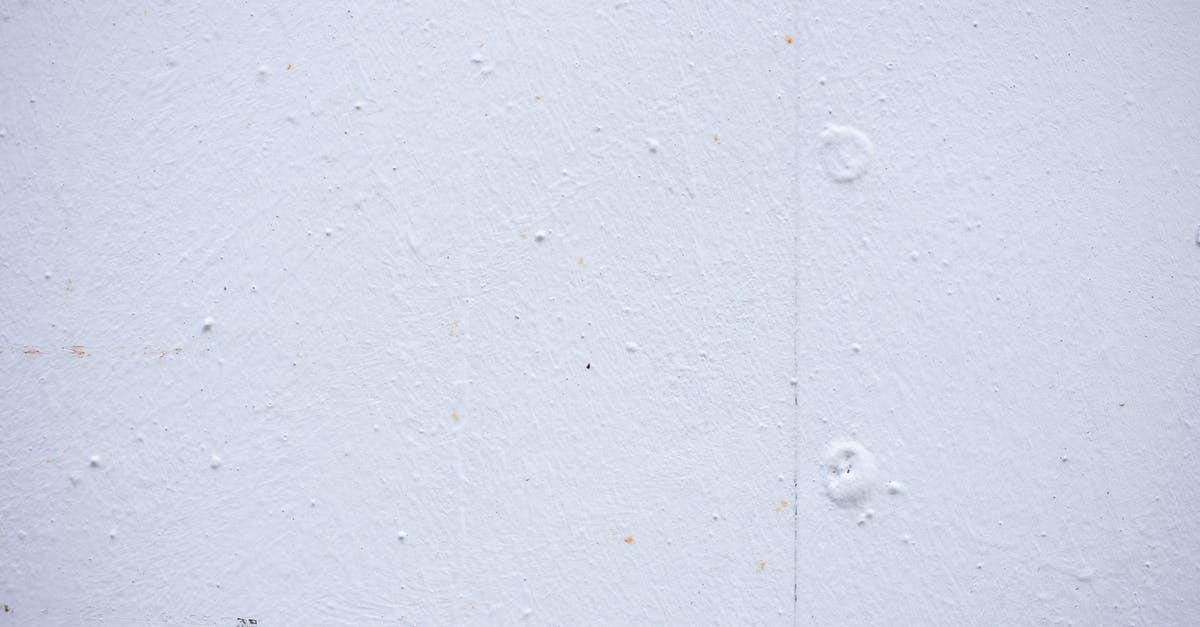 What to do with mochi...this version is white, hard and puck-like in shape? - Textured backdrop of wall with spots and dots on shabby light blue surface
