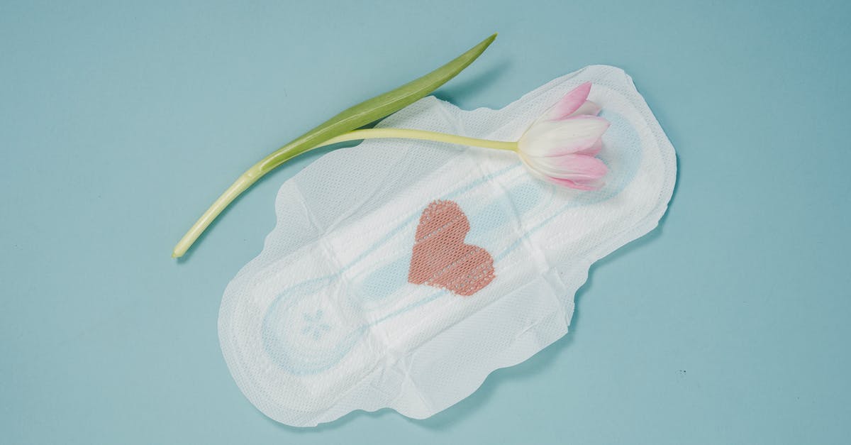 What to do with unused scallops' roe? - Feminine hygiene pad and pink tulip placed on blue background What to do with unused scallops' roe? - Feminine hygiene pad and pink tulip placed on blue background
