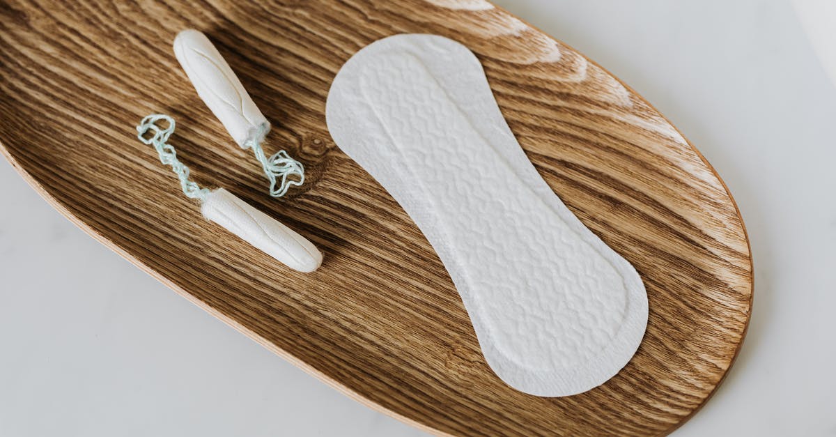 What to do with unused scallops' roe? - Products of personal hygiene for women on wooden stand What to do with unused scallops' roe? - Products of personal hygiene for women on wooden stand