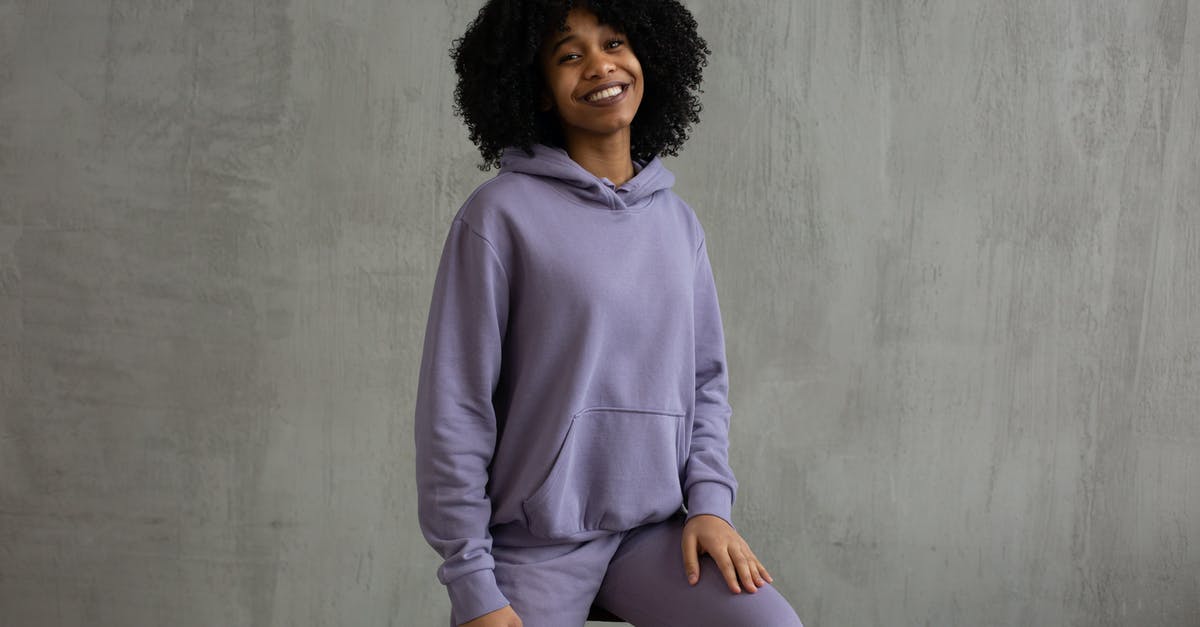 What to look in a truly dishwasher friendly non-stick cookware? - Smiling black woman in hooded sweatshirt sitting on high chair What to look in a truly dishwasher friendly non-stick cookware? - Smiling black woman in hooded sweatshirt sitting on high chair