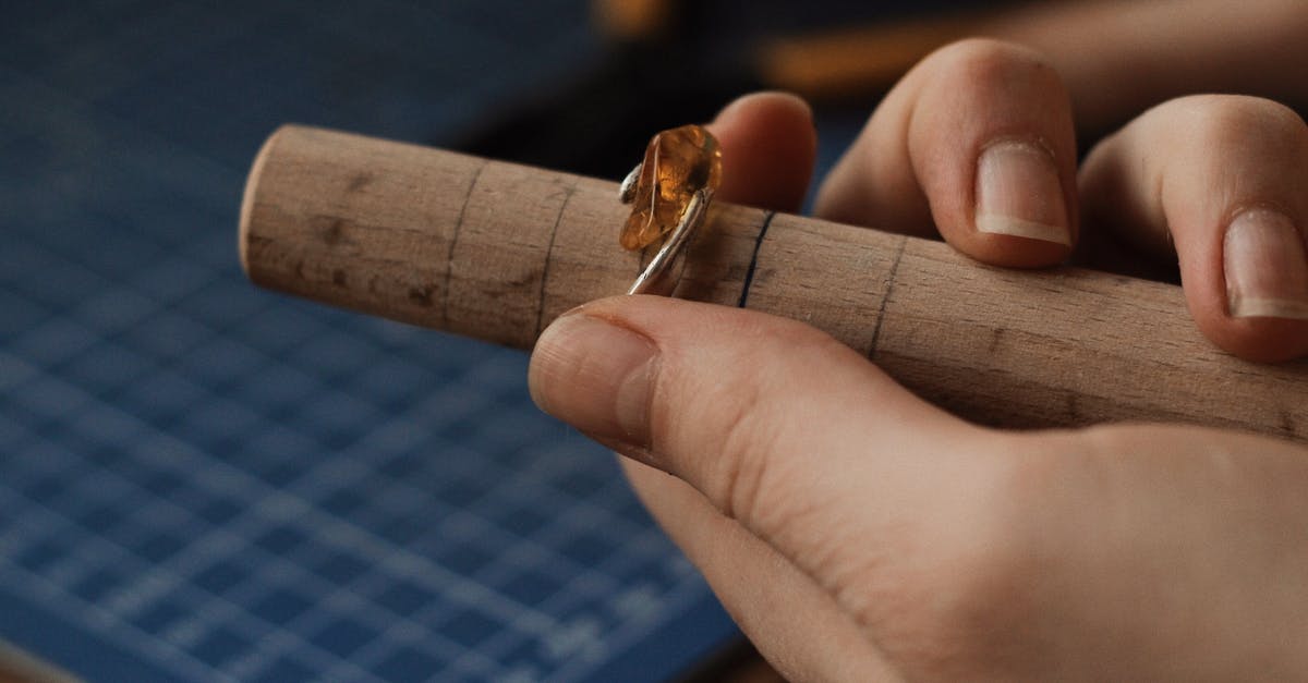 What tools are needed for making wafer cookies? - Person Holding a Silver Ring With Gemstone on a Wooden Tube What tools are needed for making wafer cookies? - Person Holding a Silver Ring With Gemstone on a Wooden Tube