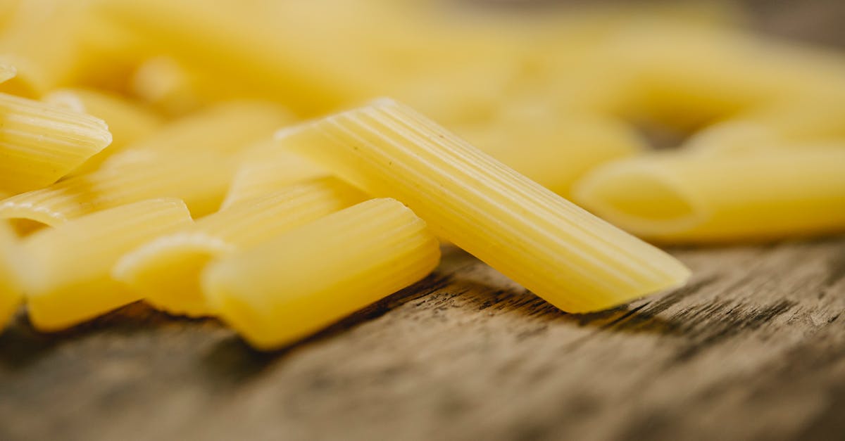 What type of flour is "wheat flour" in the UK? [duplicate] - Raw penne pasta scattered on table