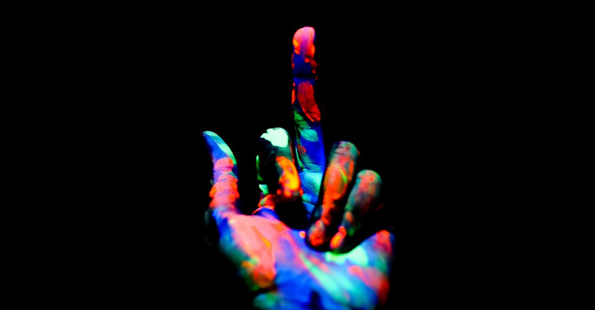 What went wrong with my brownies? - Crop anonymous persons hand painted with multicolored bright neon colors showing middle finger in obscurity What went wrong with my brownies? - Crop anonymous persons hand painted with multicolored bright neon colors showing middle finger in obscurity