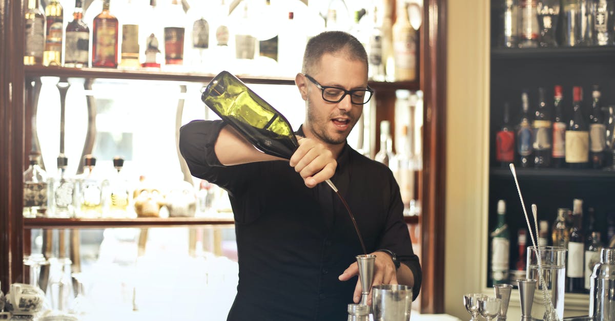 What would happen if I add wine to yeast bread? - Barman preparing cocktail at counter What would happen if I add wine to yeast bread? - Barman preparing cocktail at counter