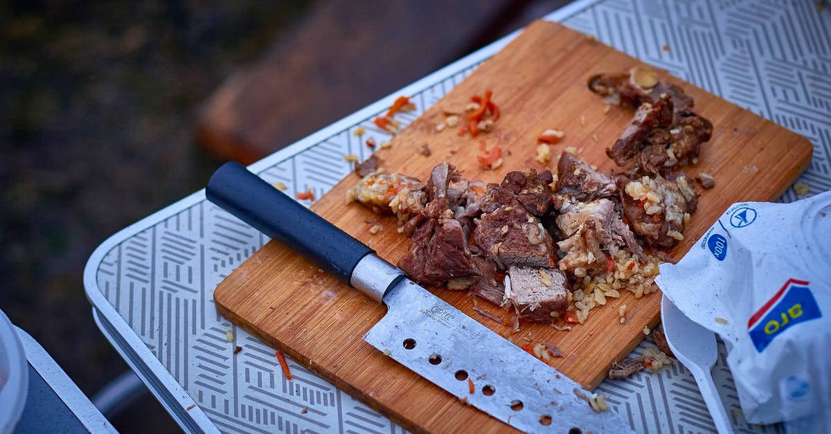 What would you call this cut of pork? - Sliced Cooked Meat on Brown Wooden Chopping Board with a Knife on Picnic Table What would you call this cut of pork? - Sliced Cooked Meat on Brown Wooden Chopping Board with a Knife on Picnic Table