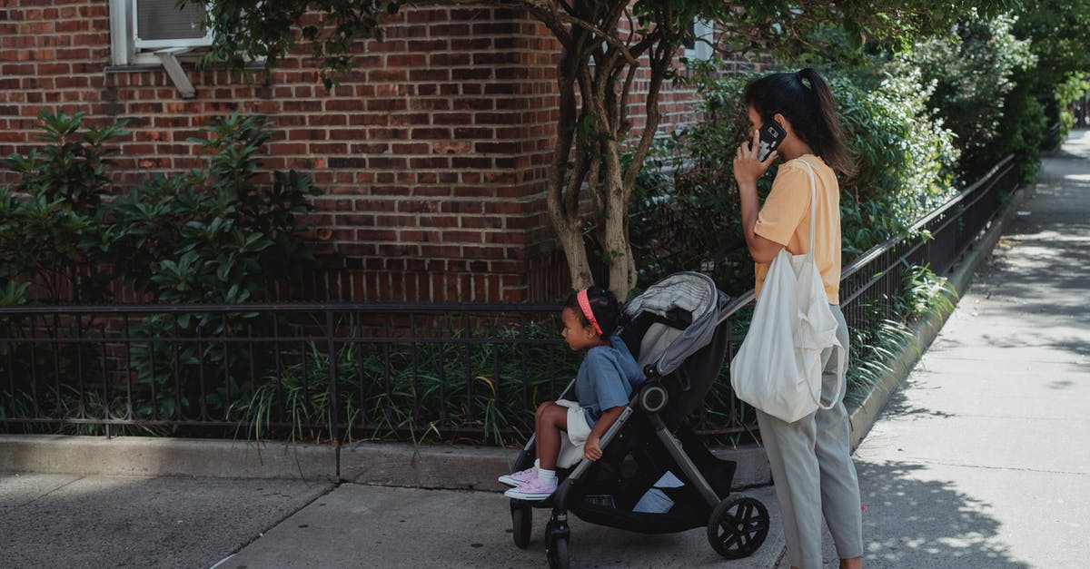 What would you call this way of cooking an egg? - Asian woman on street with daughter in baby stroller What would you call this way of cooking an egg? - Asian woman on street with daughter in baby stroller