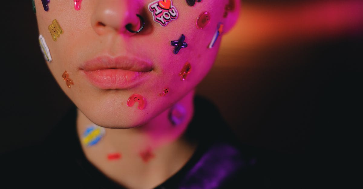 Whats causing odd flavour in reheated chicken? - Crop woman with multicolored stickers on face in dark studio Whats causing odd flavour in reheated chicken? - Crop woman with multicolored stickers on face in dark studio