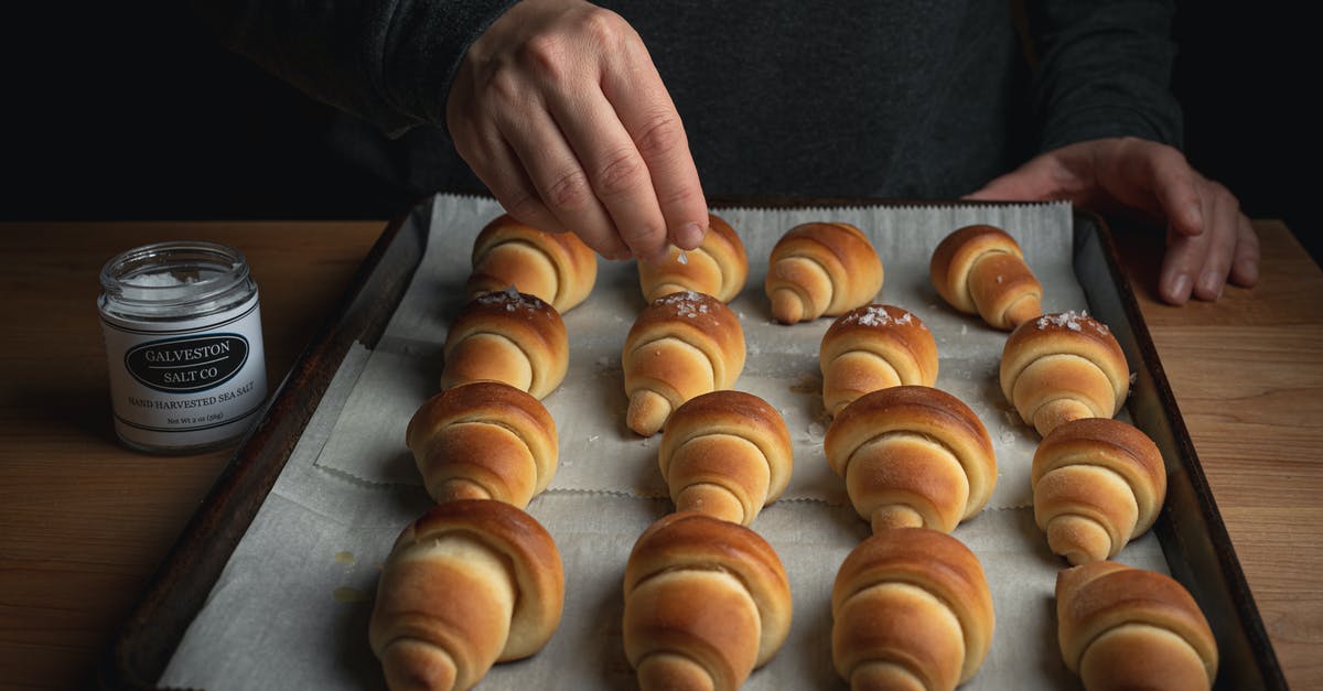 When baking what works well as a sugar substitute? - Person Topping Freshly Baked Bread with Sugar When baking what works well as a sugar substitute? - Person Topping Freshly Baked Bread with Sugar