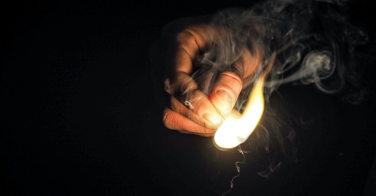 When is black burned? - Person Holding Matchstick When is black burned? - Person Holding Matchstick