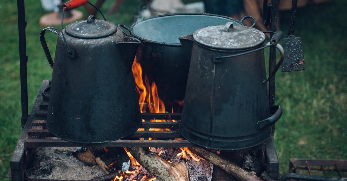 When is black burned? - Three Black and Gray Pots on Top of Grill With Fire on Focus Photo When is black burned? - Three Black and Gray Pots on Top of Grill With Fire on Focus Photo