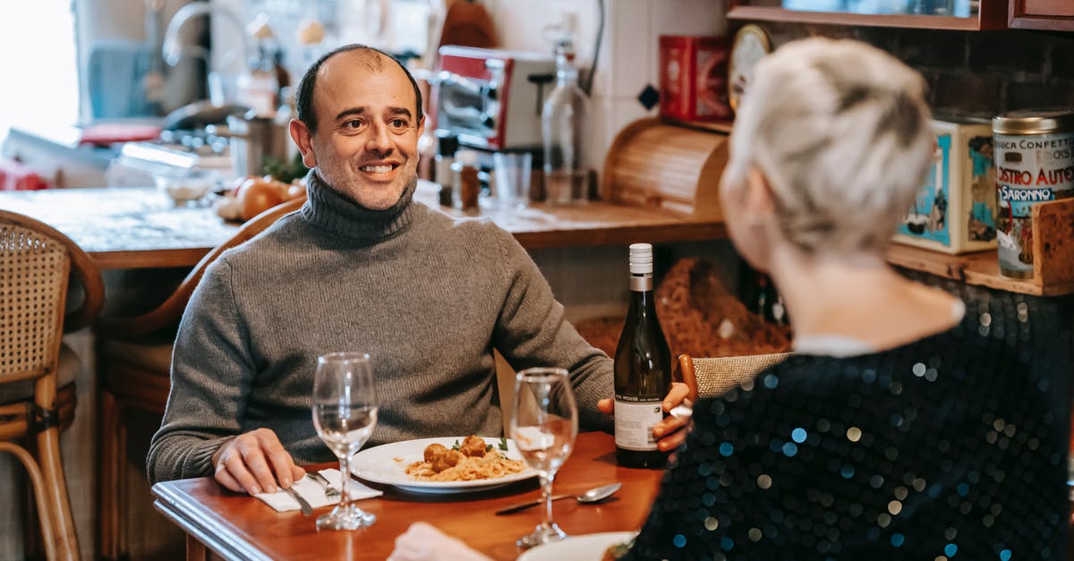 When is homemade wine-based vinegar simply bad wine? - Positive couple having date with wine and pasta in restaurant