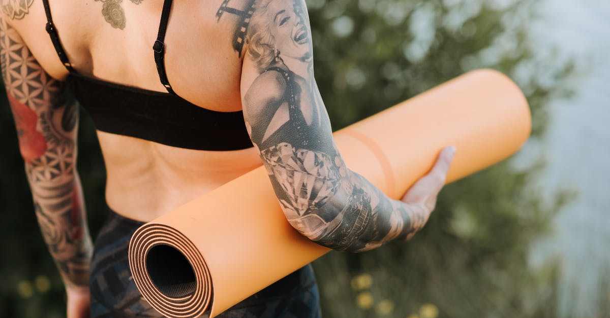 When making yogurt, why doesn't bad bacteria grow as well? - Back view of crop anonymous slender female with tattoos and rolled yoga mat standing against pond and shrub When making yogurt, why doesn't bad bacteria grow as well? - Back view of crop anonymous slender female with tattoos and rolled yoga mat standing against pond and shrub