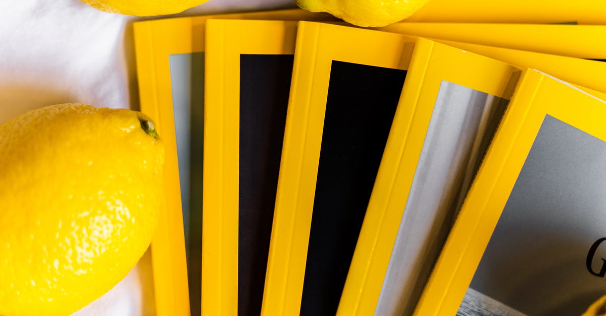 When should I use lemon zest and not just juice? - Top view of stack of similar books with yellow edges placed on white table near fresh whole lemons in daylight When should I use lemon zest and not just juice? - Top view of stack of similar books with yellow edges placed on white table near fresh whole lemons in daylight