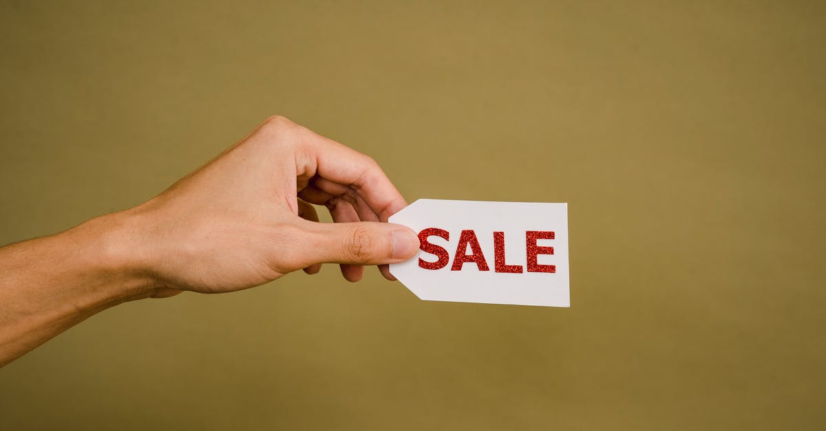 Where can I bulk-buy cheap parmesan? - Crop faceless person demonstrating sign Sale Where can I bulk-buy cheap parmesan? - Crop faceless person demonstrating sign Sale
