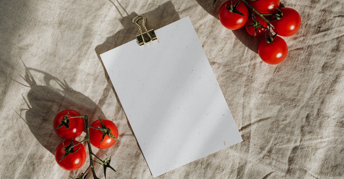 Where can I find recipes with photos of the exact meal created from the list of ingredients? [closed] - Composition of blank clipboard and ripe tomatoes