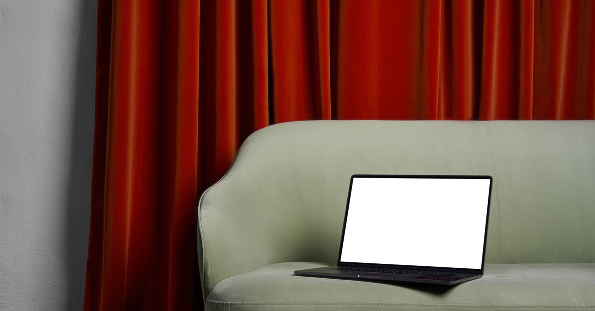 Where can I find yak butter online or in NYC? - Laptop on couch near red curtains and wall Where can I find yak butter online or in NYC? - Laptop on couch near red curtains and wall