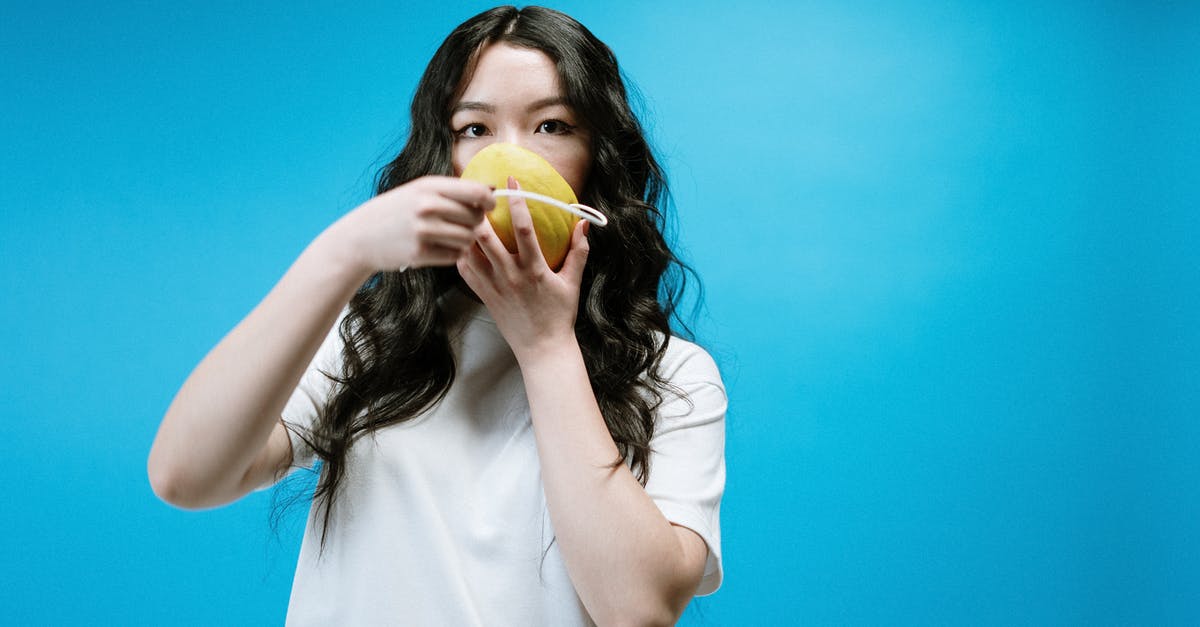 Where do I find the fruit tamarind? - Woman in White Shirt Holding Yellow Fruit Where do I find the fruit tamarind? - Woman in White Shirt Holding Yellow Fruit