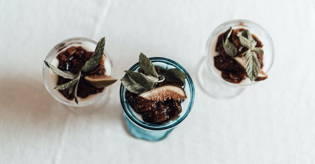 Where does the chlorine taste in yogurt come from? - From above of transparent glasses filled with delicious homemade dessert made of yogurt topped with jam mint leaf and slice of fig Where does the chlorine taste in yogurt come from? - From above of transparent glasses filled with delicious homemade dessert made of yogurt topped with jam mint leaf and slice of fig