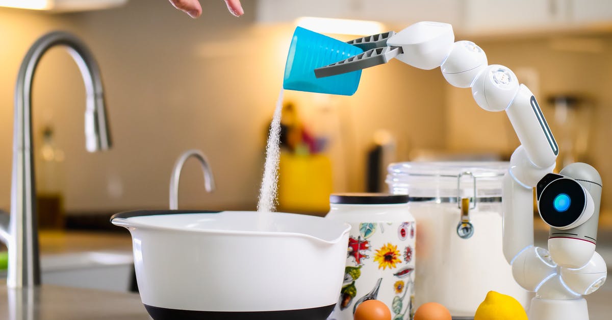 Where to order whole-wheat flour(NOT ATTA) in India? - Robot Hand Pouring Flour into White Bowl Where to order whole-wheat flour(NOT ATTA) in India? - Robot Hand Pouring Flour into White Bowl