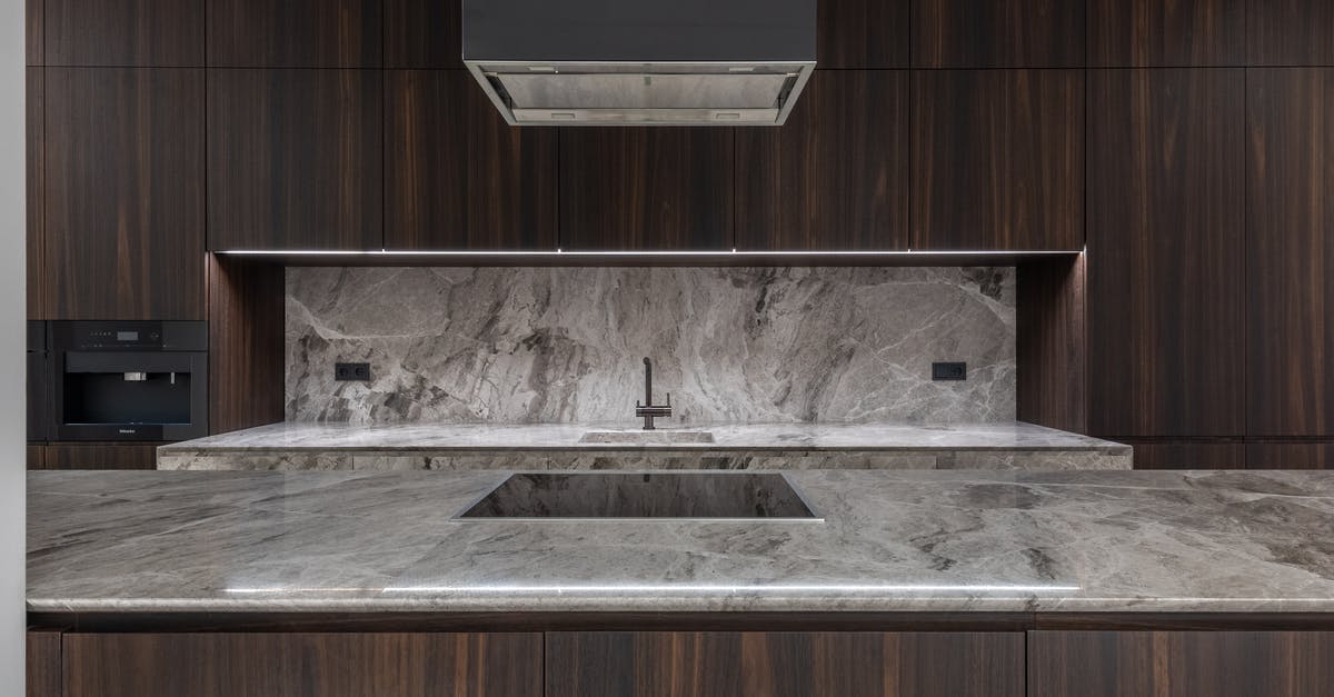 Where to place the oven thermometer in an oven? - Modern kitchen with table with stove and air extraction Where to place the oven thermometer in an oven? - Modern kitchen with table with stove and air extraction