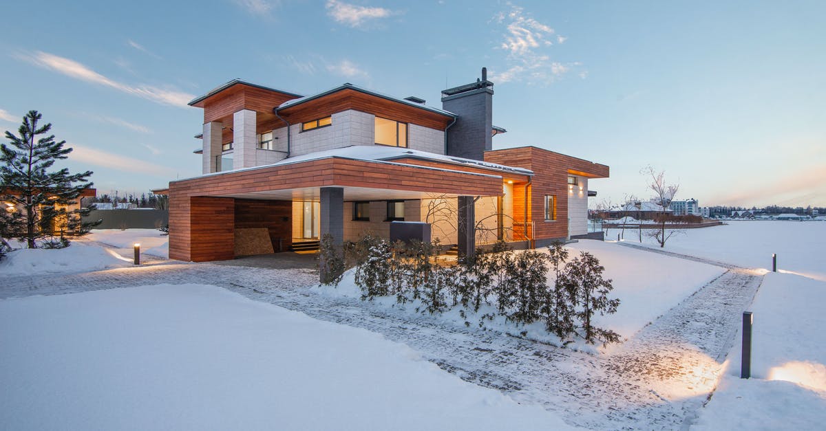Where to rent vacuum chamber? - Exterior view of luxurious residential house with roofed parking and spacious backyard in snowy winter countryside Where to rent vacuum chamber? - Exterior view of luxurious residential house with roofed parking and spacious backyard in snowy winter countryside