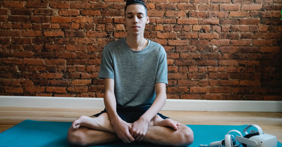 Which cooking device allows flexible temperature programming? - Full body of focused male teenager in activewear meditating in lotus pose on mat near VR glasses Which cooking device allows flexible temperature programming? - Full body of focused male teenager in activewear meditating in lotus pose on mat near VR glasses