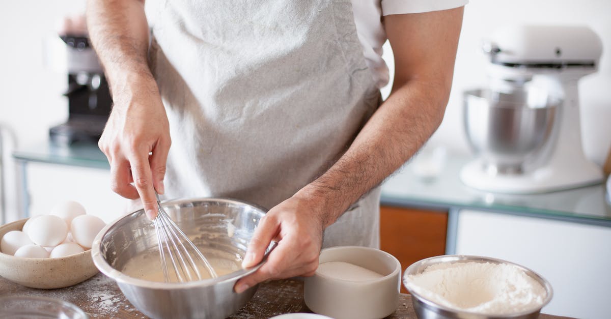 Which flour or batter mixture gives the longest lasting, crispiest coating? - A Person Mixing a Batter using a Wire Whisk Which flour or batter mixture gives the longest lasting, crispiest coating? - A Person Mixing a Batter using a Wire Whisk