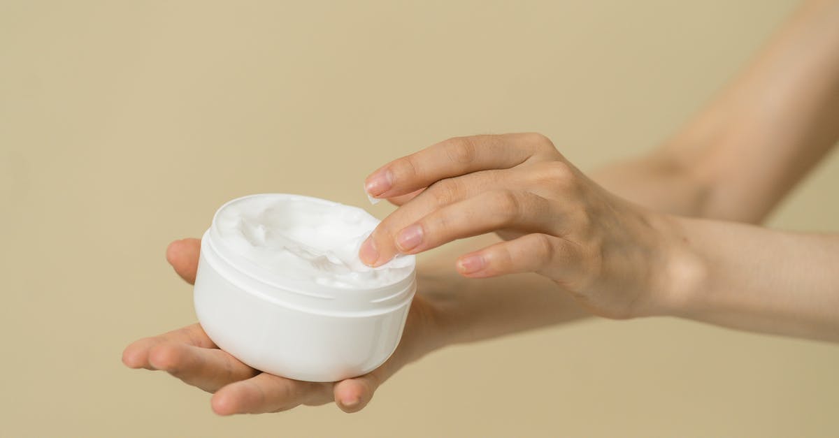 Which kind of cream do I use for creme brulee? - Woman taking cosmetic product from container Which kind of cream do I use for creme brulee? - Woman taking cosmetic product from container