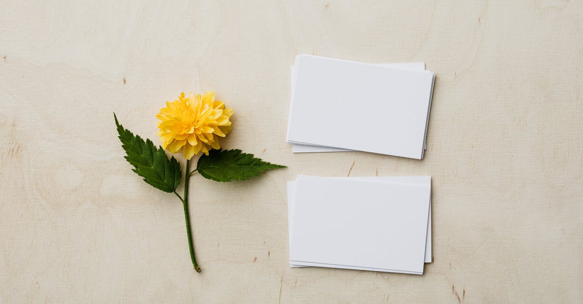 Which product for white chapatis? - Blank mockup business cards and yellow flower on desk Which product for white chapatis? - Blank mockup business cards and yellow flower on desk