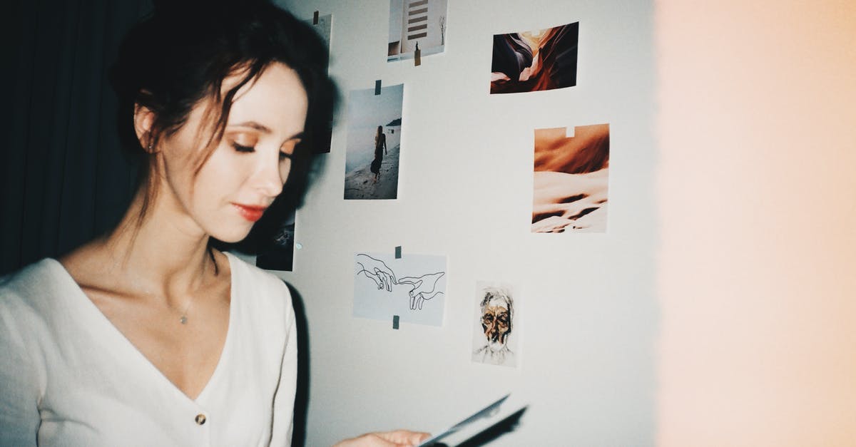 Which side of the baking paper should face up? - Woman in White Scoop Neck Shirt Holding a Paper Which side of the baking paper should face up? - Woman in White Scoop Neck Shirt Holding a Paper