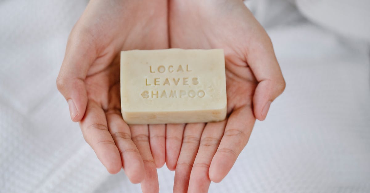 Which vinegars are essential to keep on hand? - Woman with organic soap in hands